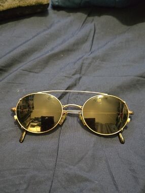 Giorgio Armani oval eyeglasses featuring a removable clip-on sunglass attachment